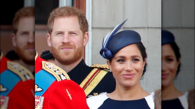 Prince Harry, Meghan Markle, tous deux souriants