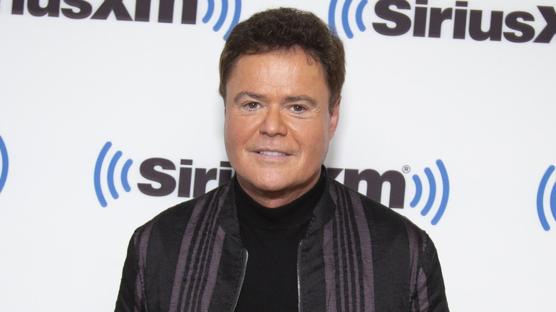 Sourire subtil de Donny Osmond