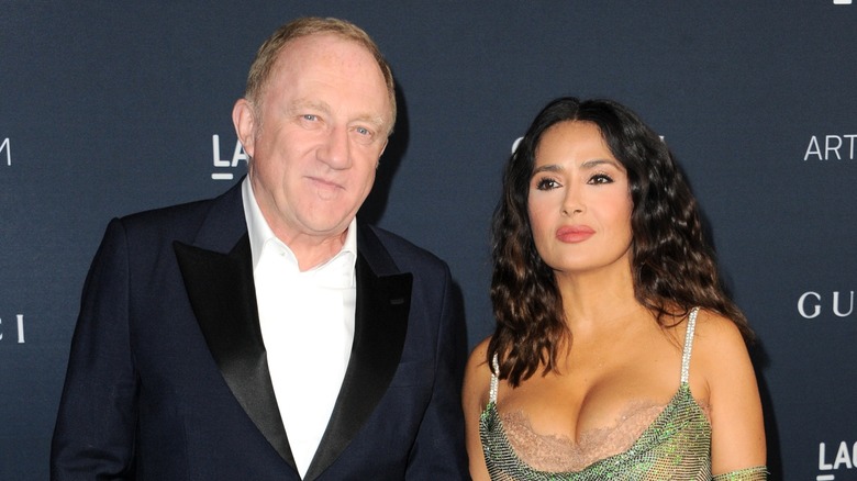 François-Henri Pinault souriant, Salma Hayek aux cheveux bouclés