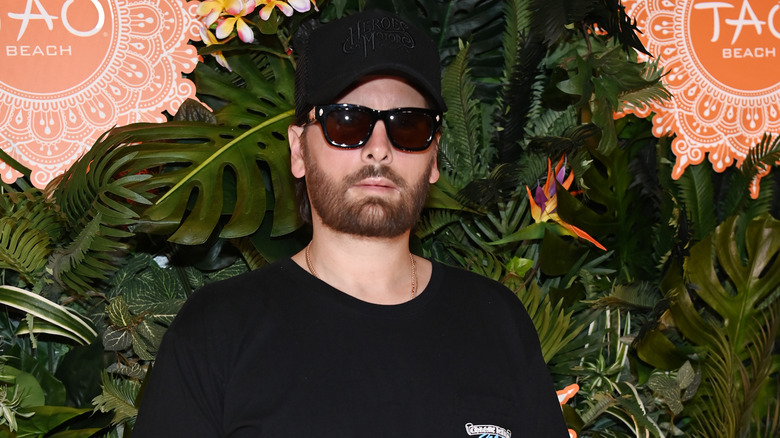 Scott Disick in wearing sunglasses