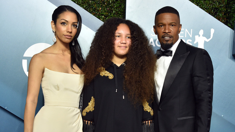 Jamie Foxx poses with Corinne and Annalise