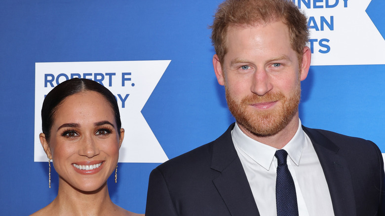 Meghan Markle et le prince Harry sourient