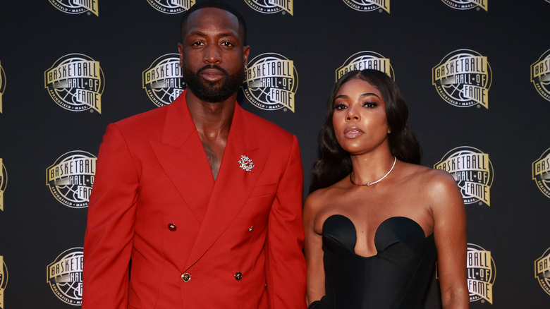 Dwyane Wade et Gabrielle Union posant ensemble lors d'un événement