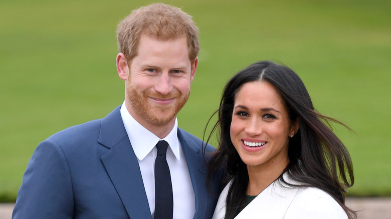 Le prince Harry et Meghan Markle souriants