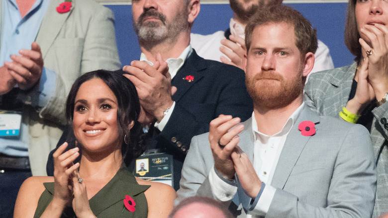 Meghan Markle et le prince Harry applaudissent