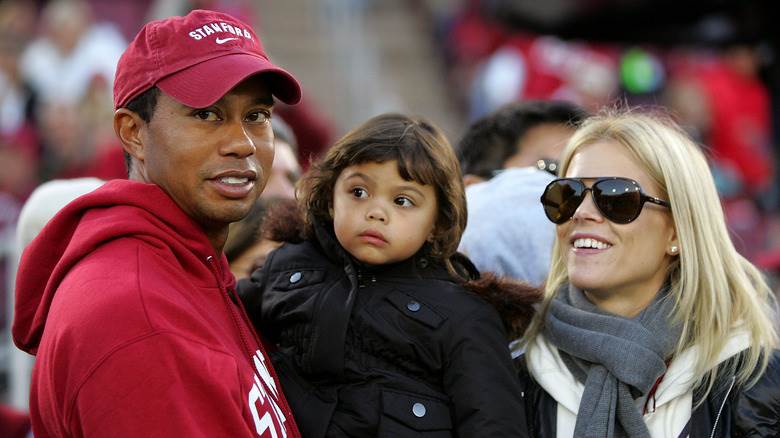 Tiger Woods, Sam Alexis Woods et Elin Nordegren souriant en 2009