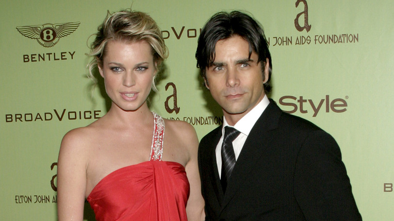 Rebecca Romijn et John Stamos lors d'un événement