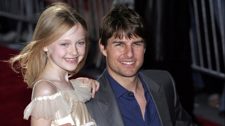 Tom Cruise et la jeune Dakota Fanning tout sourire