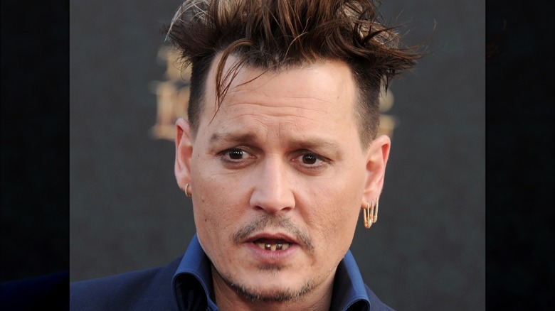 Boucles d'oreilles dents en or Johnny Depp